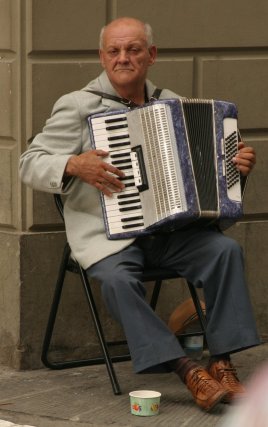 Accordion player on a street corner in Firenze